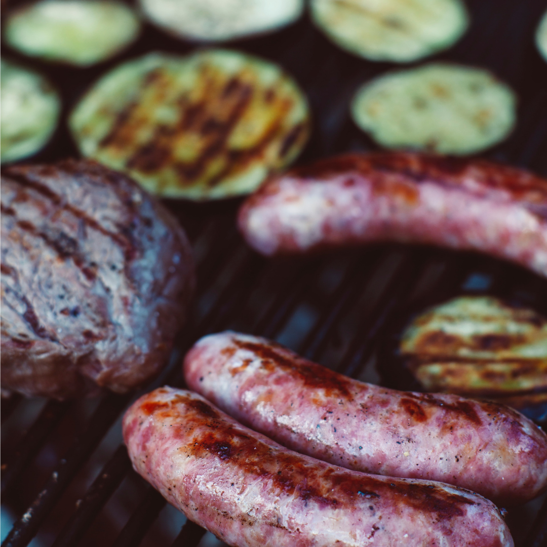 can you eat meat and be healthy? sausages burger and eggplant on a grill